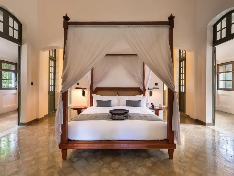 Hotel room with white sheer curtains
